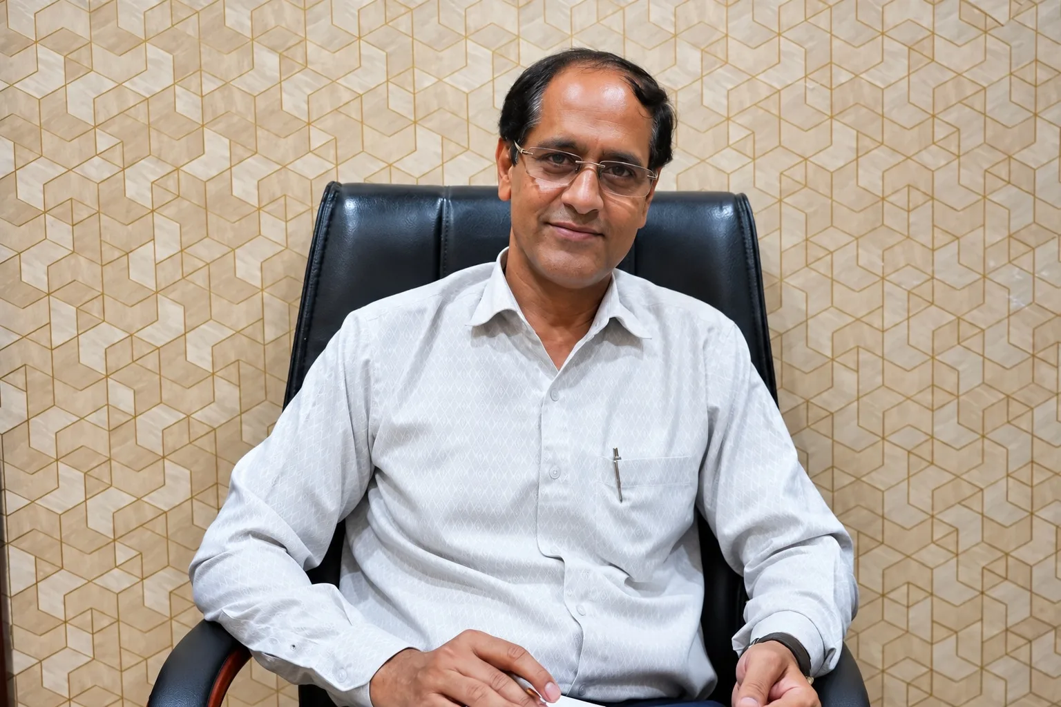 Dr. Mukesh Tiwari, orthopaedic surgeon, seated portrait in his Jaipur clinic